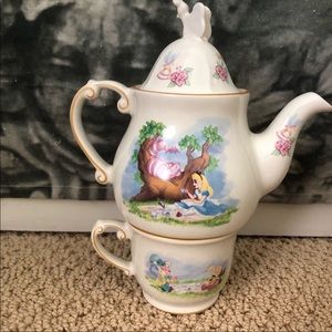 RESERVED.     Disney Teakettle and cup and saucer